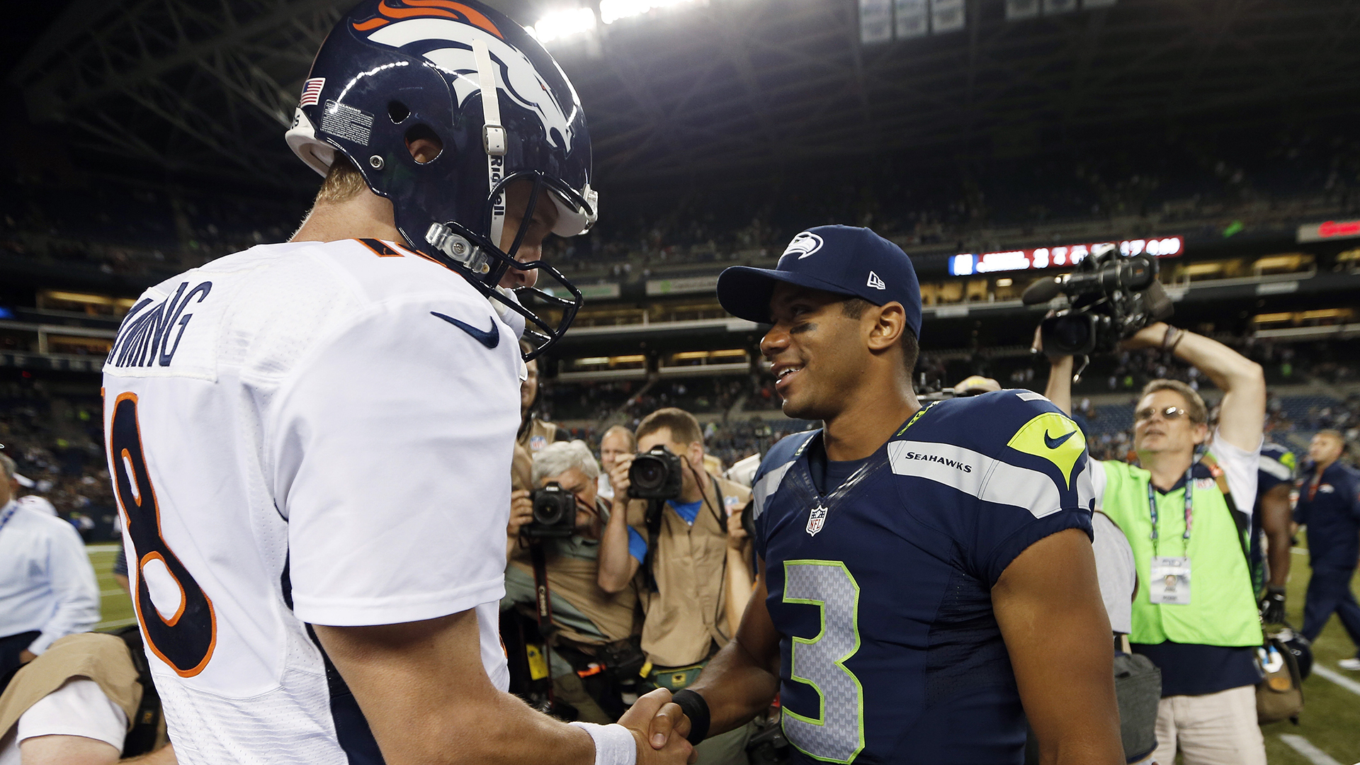 Rockies' Todd Helton watches ex-teammate Peyton Manning on Broncos